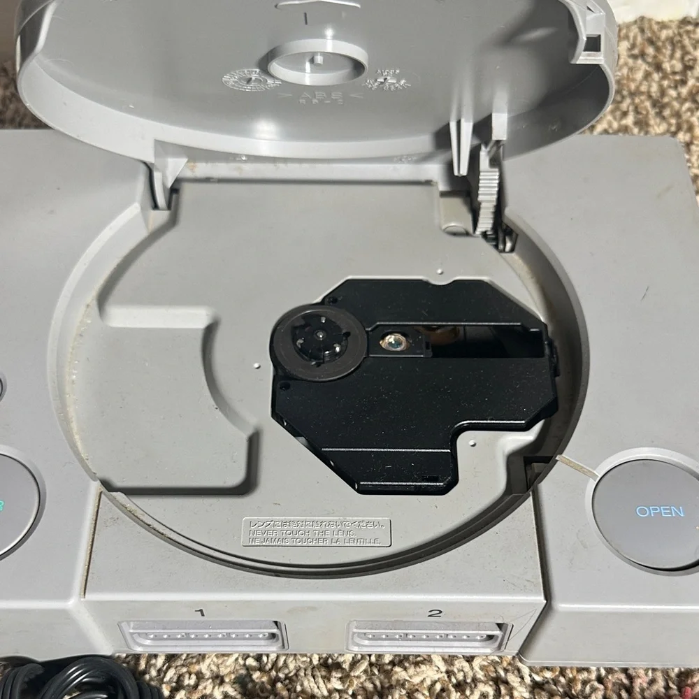 Sony PlayStation Console with Translucent Red Controller